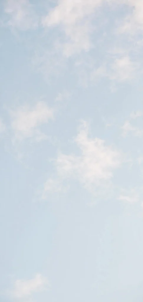 Soft white clouds on pale blue sky