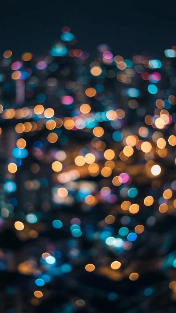 17 Best Wallpaper Backgrounds for Laptop Screens 13 Night city lights bokeh wallpaper backgrounds for laptop on a dark background
